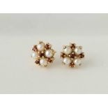 A pair of pearl and garnet ear studs 9ct 2.5 gms