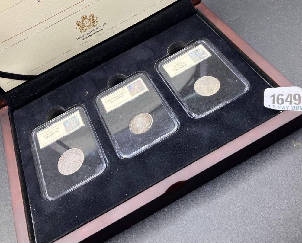 A boxed Three Queen shilling collection, The QueenAnne shilling 1711, Victoria 1898 & Elizabeth