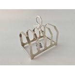 Five bar toast rack with ring handle. 3 in wide. Birmingham By B & co 50gm