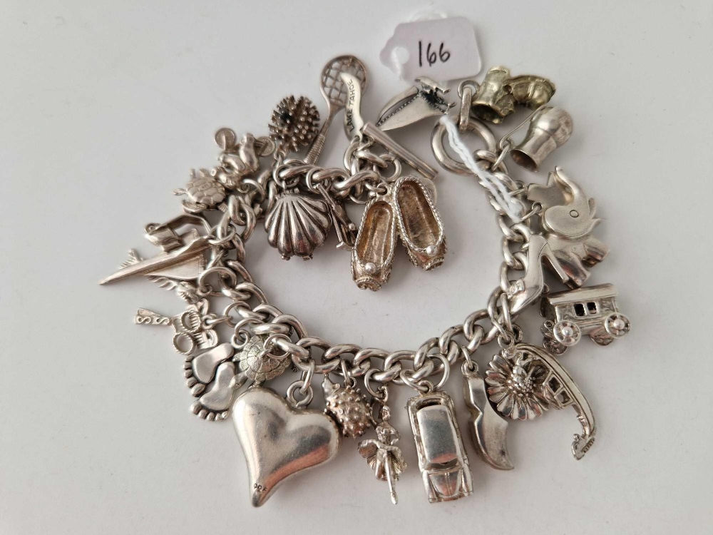 A heavy silver charm bracelet 103 gms