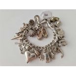 A heavy silver charm bracelet 103 gms