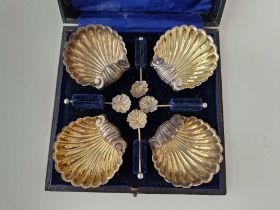 Boxed set of Four shell shaped salts with matching spoons. Chester 1895