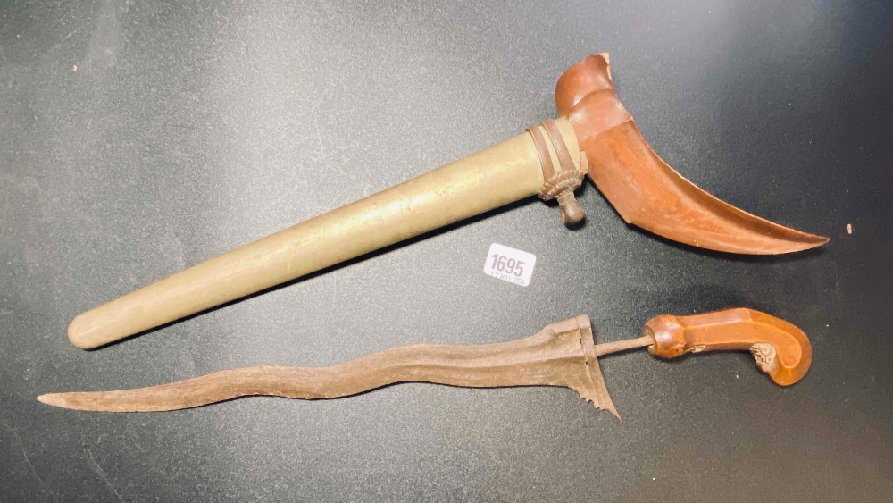 Wooden handled dagger with wavy blade