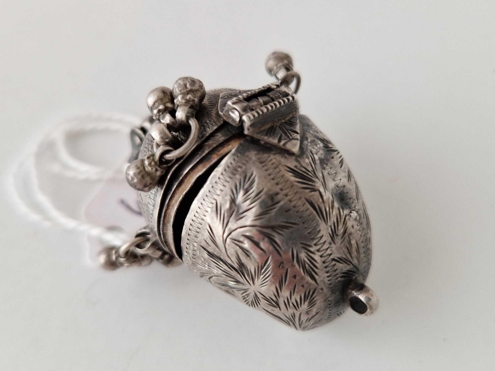 A unusual hinged tribal silver pendant opening to reveal two compartments - Image 2 of 3