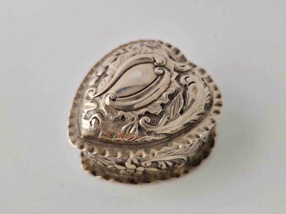A 1888 silver heart shaped ring box