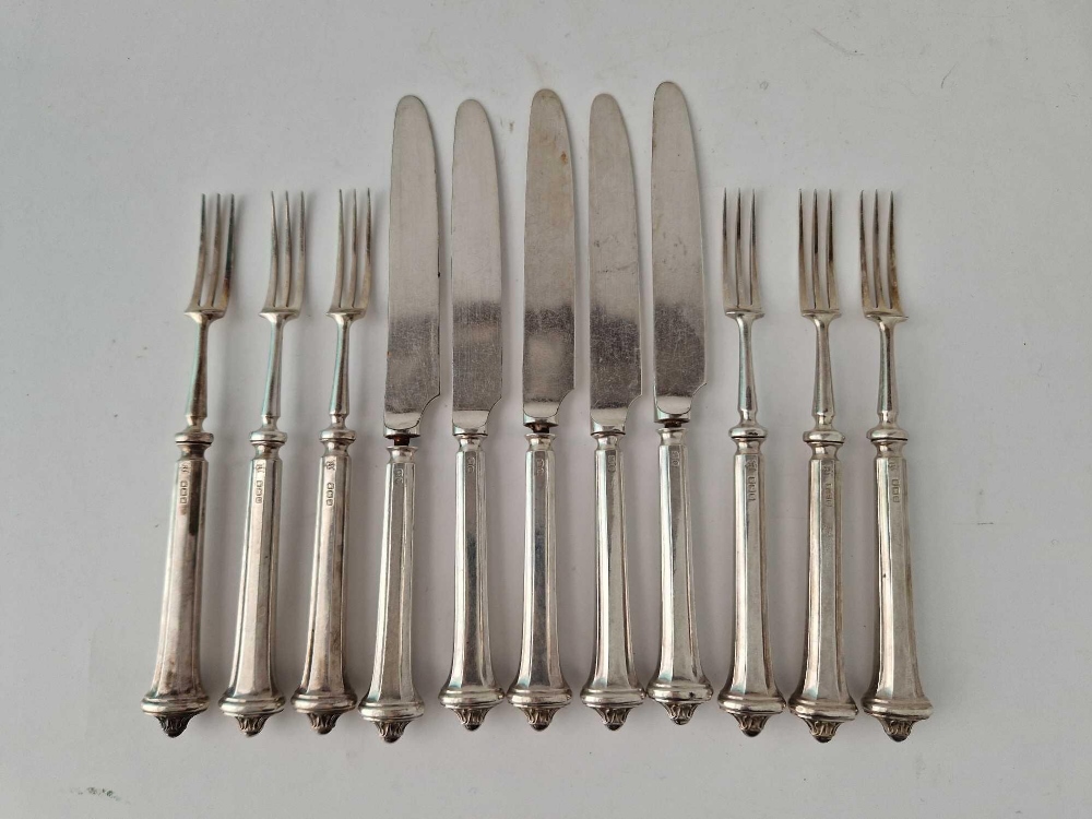 Eleven silver handled fruit knives and forks, Sheffield 1914