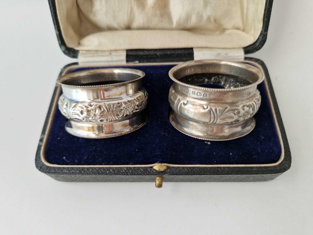 Pair of boxed napkin rings with embossed panel. Birmingham 1918