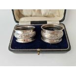 Pair of boxed napkin rings with embossed panel. Birmingham 1918