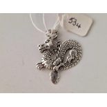 A silver dragon pendant