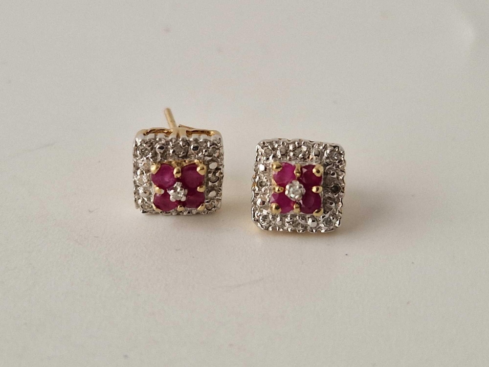 A pair of diamond and ruby square cut stud earrings 9ct 2 gms