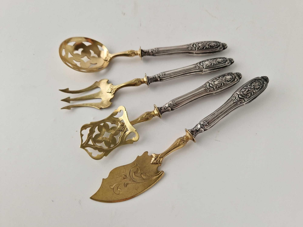 A set of four Continental silver handled serving spoons and forks