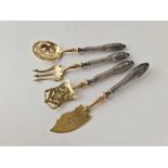 A set of four Continental silver handled serving spoons and forks