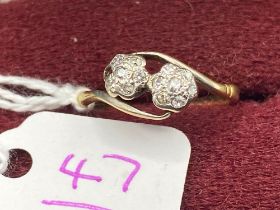 A Edwardian diamond dress ring double floral cluster in 18ct gold and platinum size N
