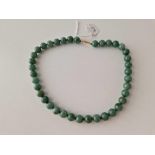 A green hard stone bead necklace