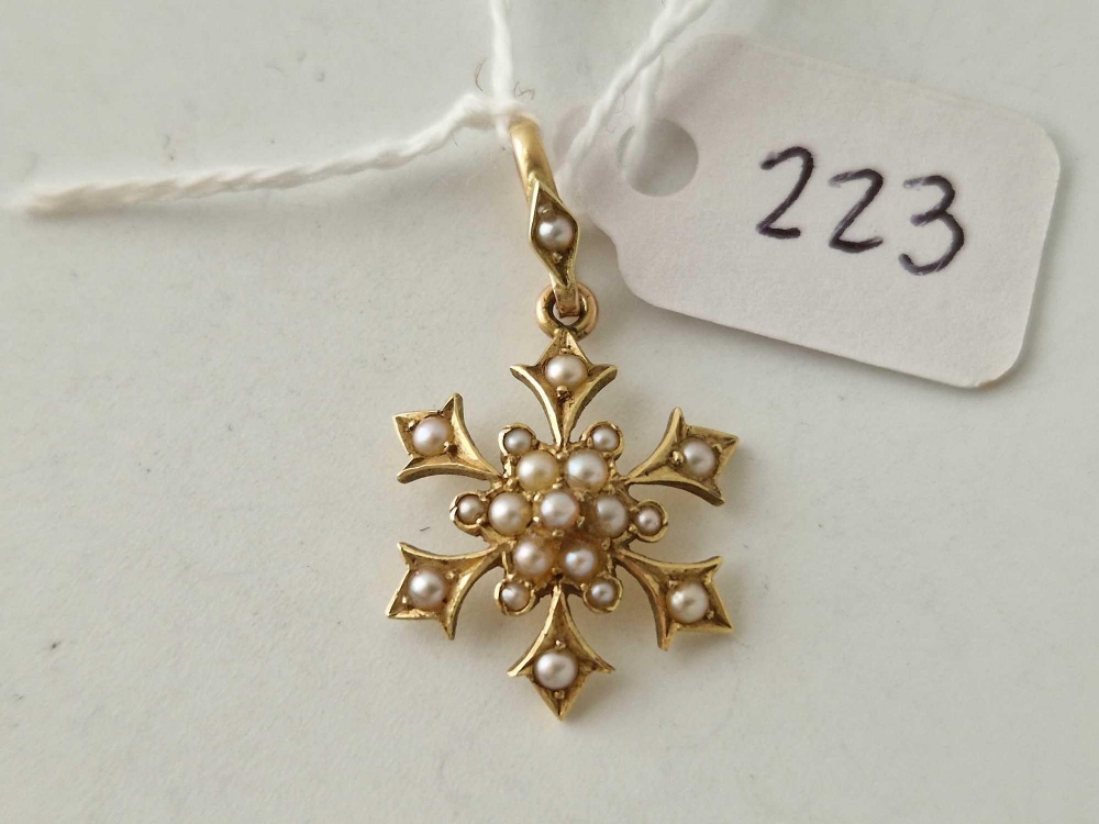 A Edwardian half pearl snowflake design pendant drop 15ct gold