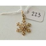 A Edwardian half pearl snowflake design pendant drop 15ct gold