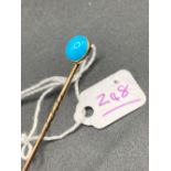 A bright vintage turquoise stick pin High ct. gold