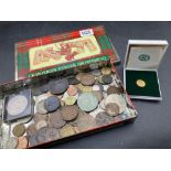A tin of WORLD coins some interesting, some silver