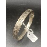 A hinged silver bangle