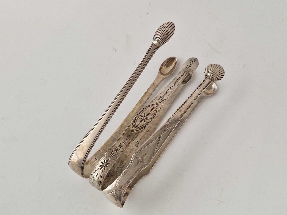 Three pairs of Georgian brightcut beaded edge sugar tongs. 98gm