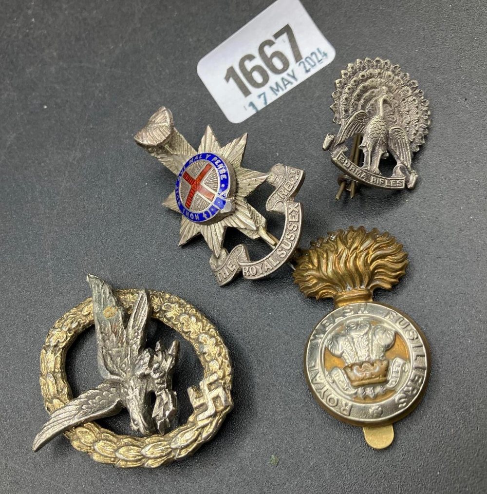 An enamal decorated Badge The Royal Sussex & 3 others