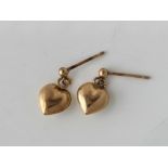 A pair of heart dangle earrings 9ct