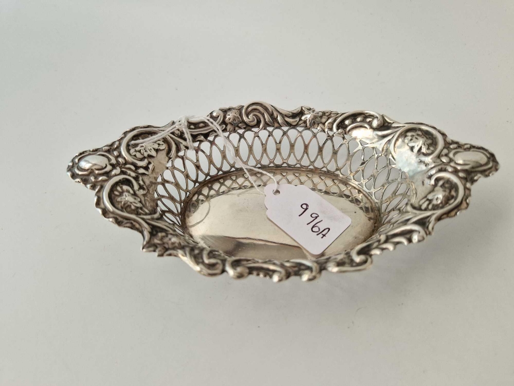 Oval boat shaped sweet dish embossed sides. 6 in long. Birmingham 1905