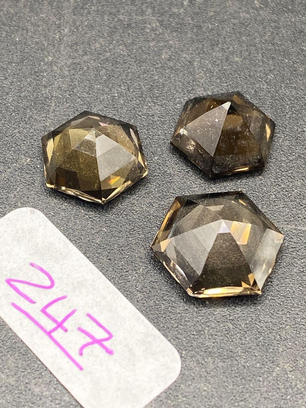 A pair of matched octagonal smokey quartz gem stones with a larger single gem stone to match 28 - Image 2 of 2