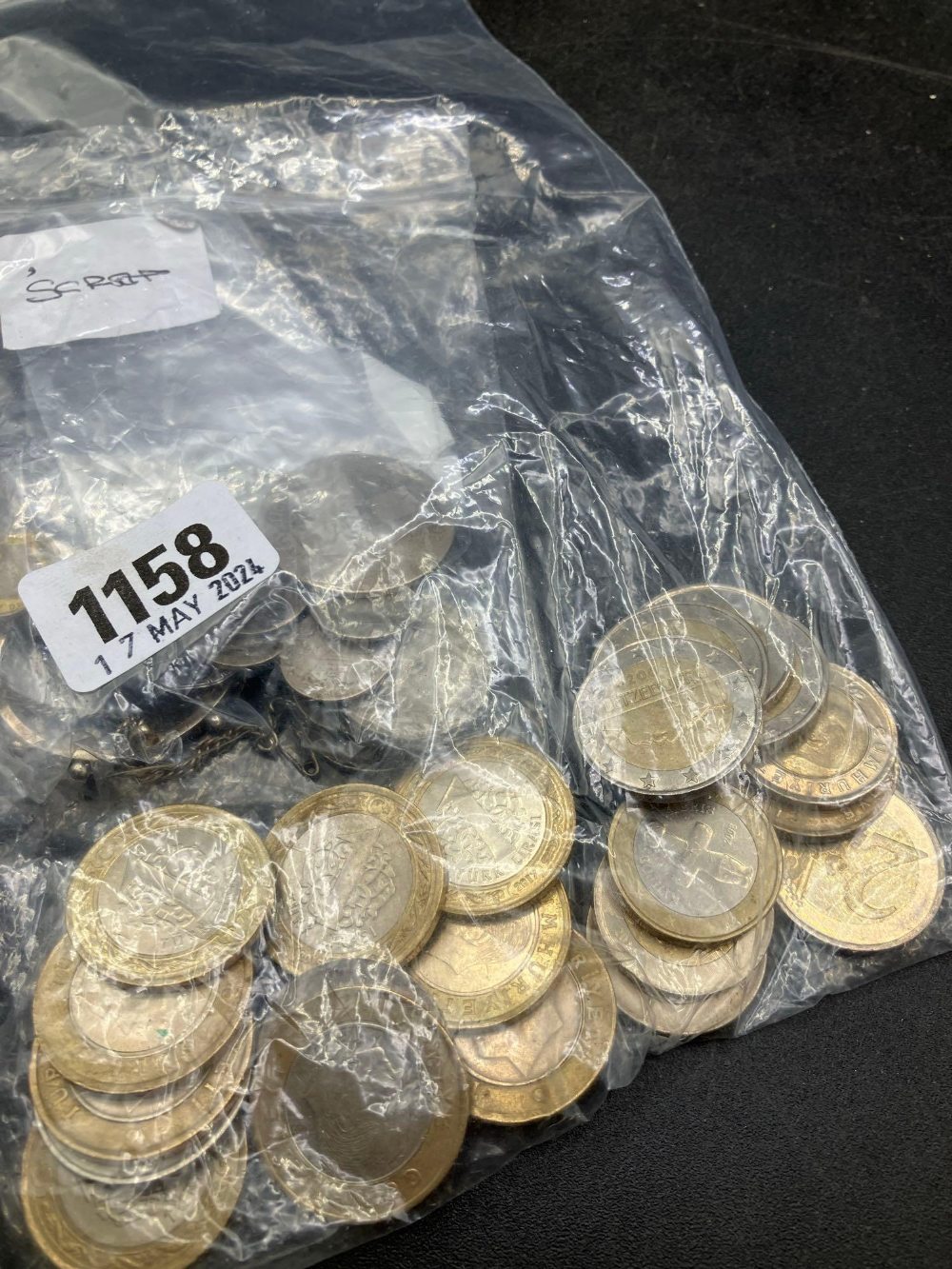 One bag of Euro coins and one bag of silver scrap coins