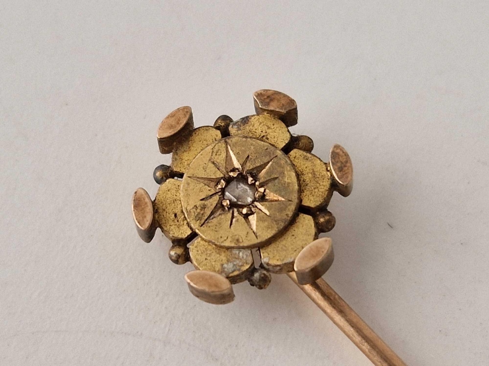 A gold stick pin set with a diamond 2.4 gms