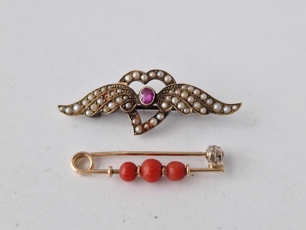 A 15ct gold coral bar brooch and 15ct gold ruby and seed pearl bar brooch