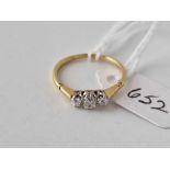 A three stone diamond ring 18ct gold size M 1.8 gms