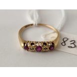 A five stone ruby and diamond ring 18ct gold size S 2.9 gms