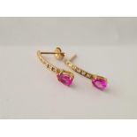 A pair of ruby and gem set earrings 10ct gold