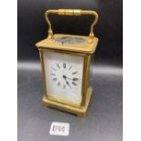 Another brass repeating carriage clock with repeat button and striking bell. 7 in high By Brook