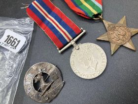 A Pacific Star, A 1939/45 War medal & a silver badge