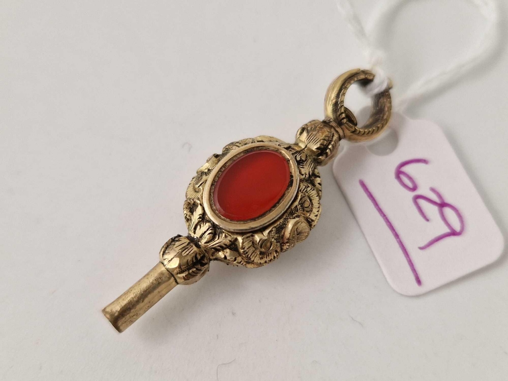 A antique stone set watch key
