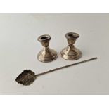 A sterling silver tea infuser pipe and a pair of candlestick