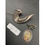 A large silver marcasite bird brooch and silver pendant