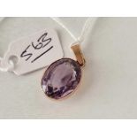 A purple gem stone pendant