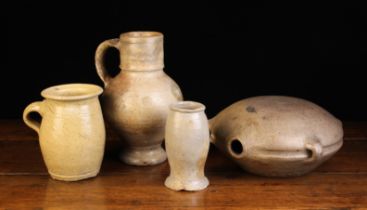 Four Pieces of Stoneware Pottery: A 17th/18th Century Jug (A/F) with a cylindrical neck above a