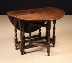 An 18th Century Oak Gateleg Table.