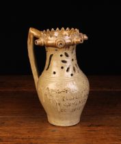 A Burton in Londsdale Stoneware Puzzle Jug with a serrated rim featuring five protuberant spouts