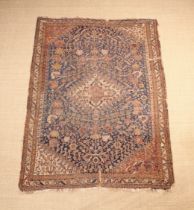 An Antique Senneh Rug, (A/F). 71" x 51" (180 cm x 130 cm).