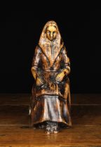 A Late 19th/Early 20th Century Stained Wooden Carving of a Seated Woman, possibly Welsh,