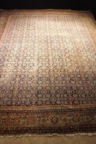 An Antique Feraghan Carpet, West Persian, worn. 194" x 157" (497 cm x 400).