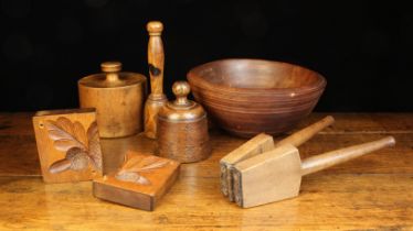 A Group of Treen Items: A fruitwood raised pie mould 5½" (14.5 cm) high, 5¼" (14 cm) in diameter.