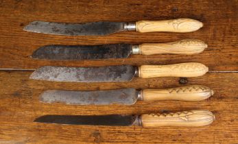 Five Late 19th/Early 20th Century Bread Knives with carved wooden handles including one with a