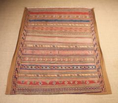 A Decorative Hanging Rug/Curtain woven with striped bands of geometric motifs 77½" x 64" (197 cm x