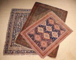 Three Antique Persian Rugs: 70" x 53" (178 cm x 135 cm),